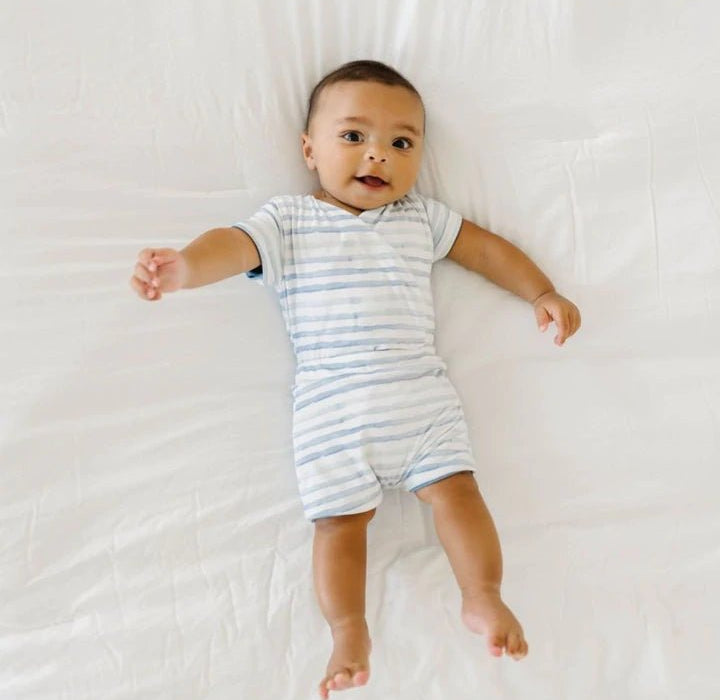 Short-sleeve winged bodysuit featuring the Chambray Waves print in cozy classic brushed fabric.