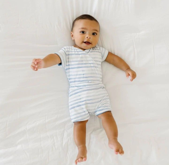 Short-sleeve winged bodysuit featuring the Chambray Waves print in cozy classic brushed fabric.