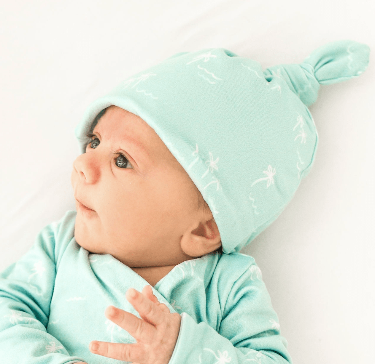 Reversible baby beanie featuring the Honeydew Palms print with cozy classic brushed softness.