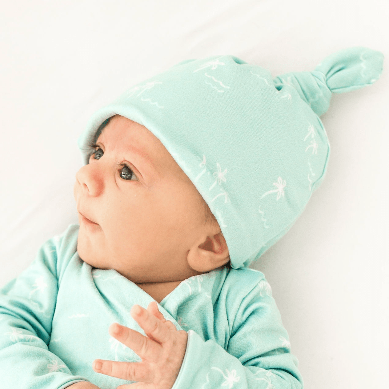 Reversible baby beanie featuring the Honeydew Palms print with cozy classic brushed softness.