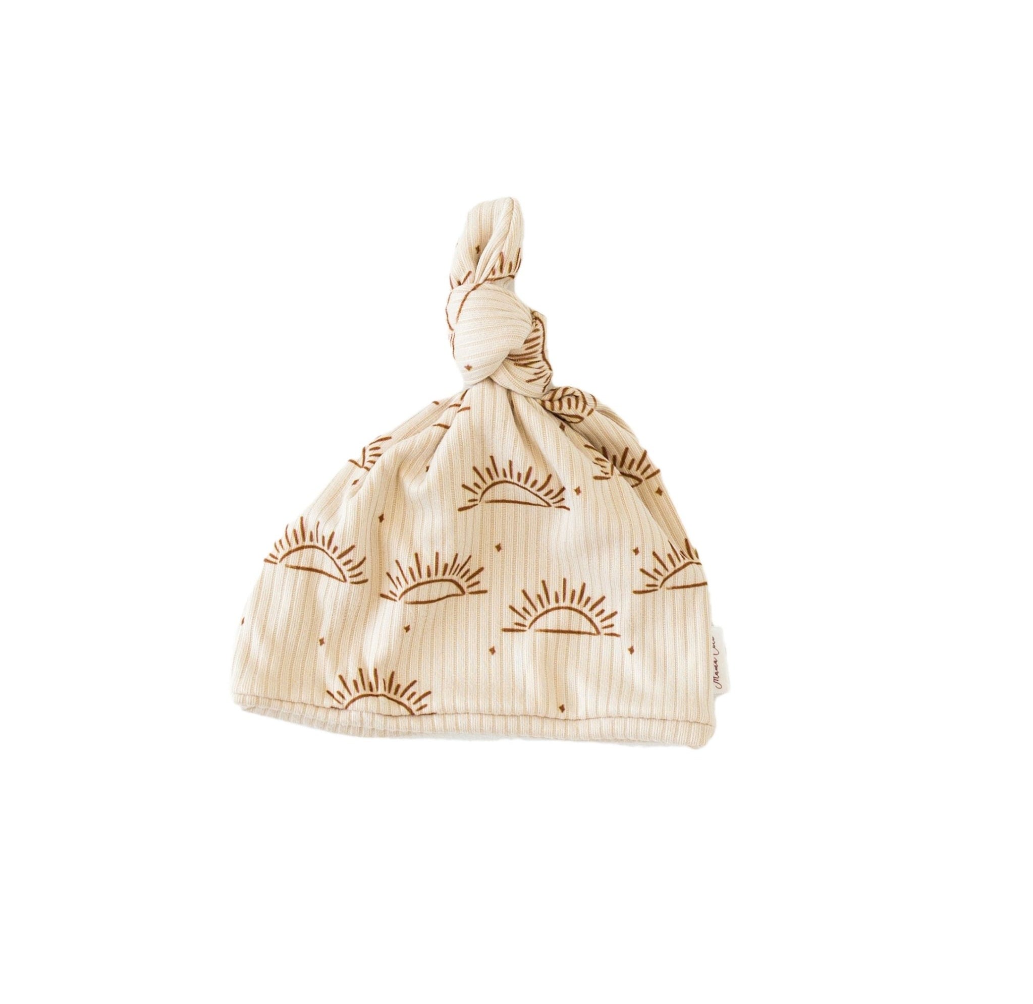 Reversible baby beanie featuring the Sandy Sunsets print with cozy classic brushed softness.