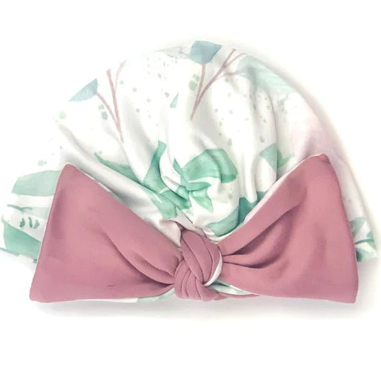 Soft ruched baby beanie with bow made from classic brushed fabric in the Blushing Eucalyptus design.