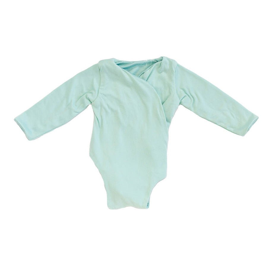 Reversible Honeydew Palms design long sleeved winged bodysuit in classic brushed fabric.