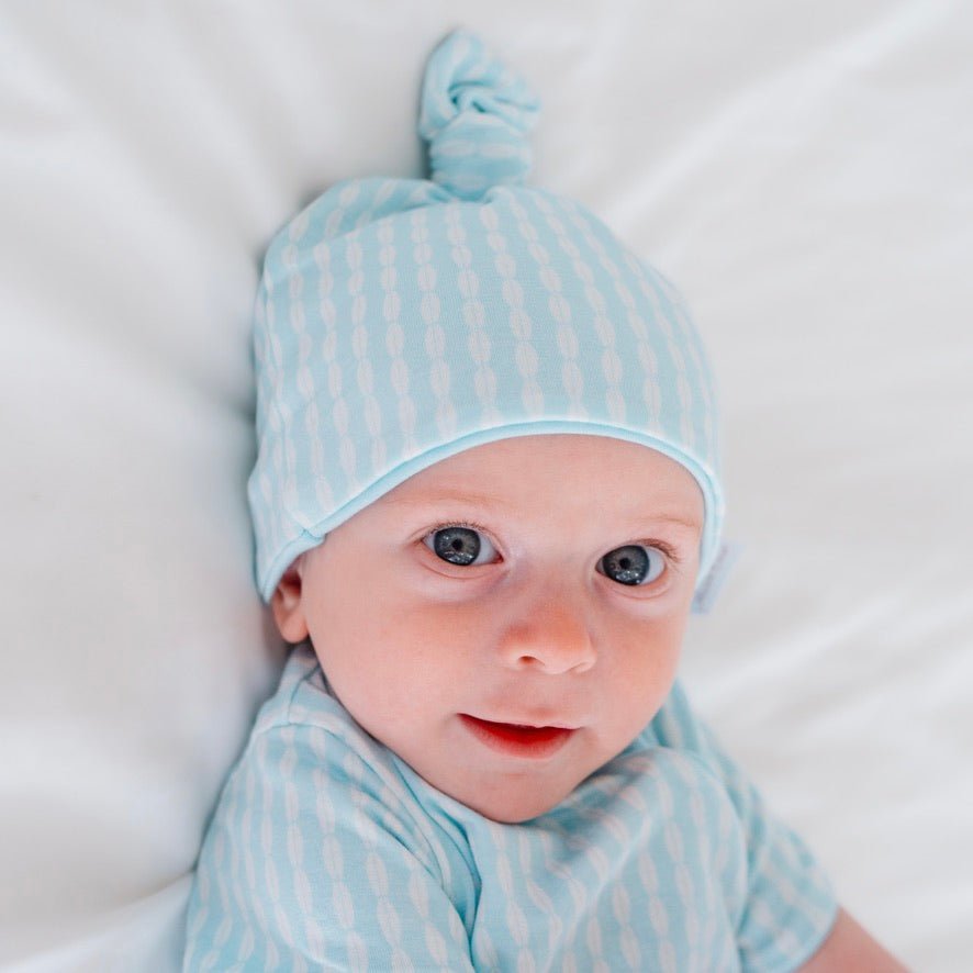 Baby beanie from our long-sleeve onesie outfit bundle.