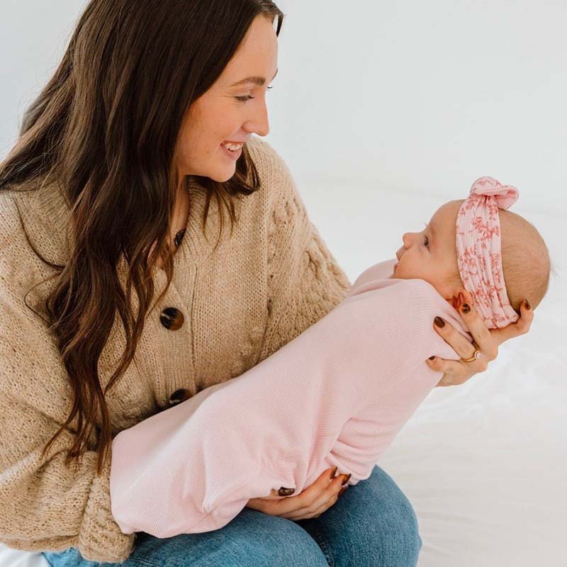 Newborn comfort meets Bitty Pink Blooms in this Cocoon swaddle baby blanket in Silky Modal fabric styles.