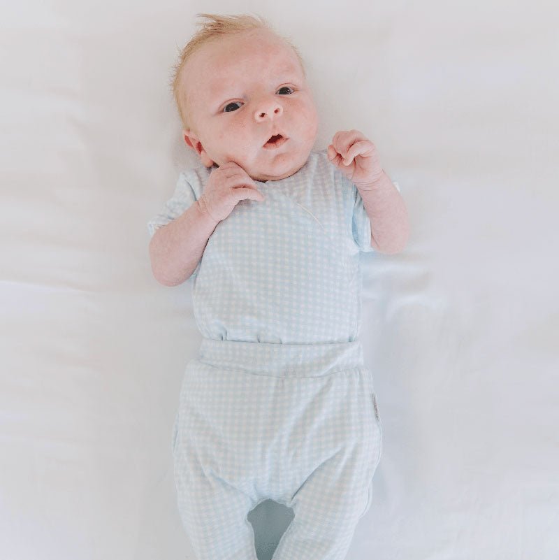 Baby winged bodysuit made from silky modal fabric in Baby Blue Gingham design.