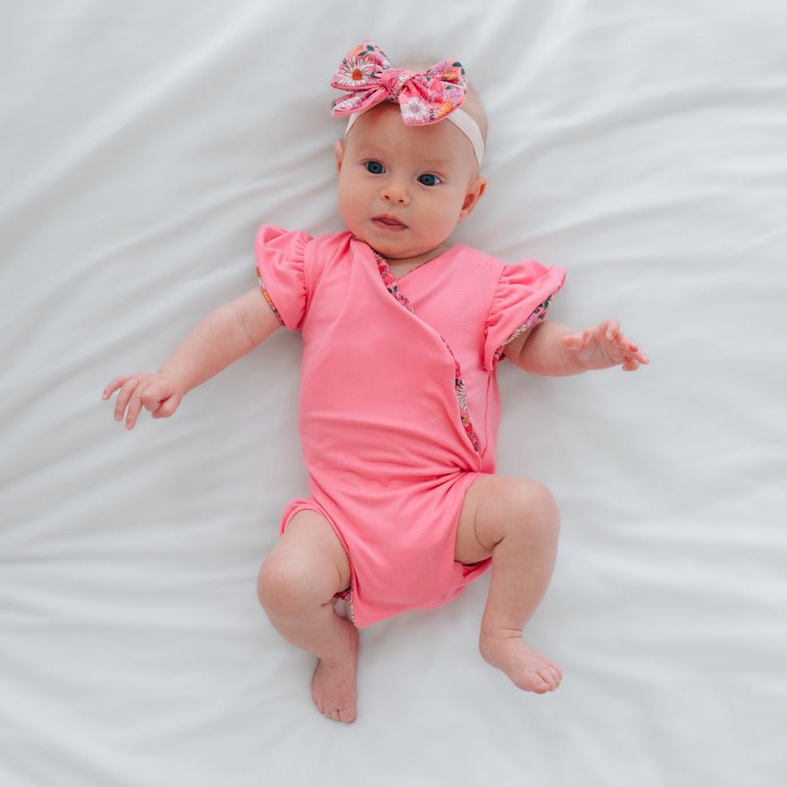 Reversible Flower Power print baby bodysuit crafted in Classic Brushed fabric styles.