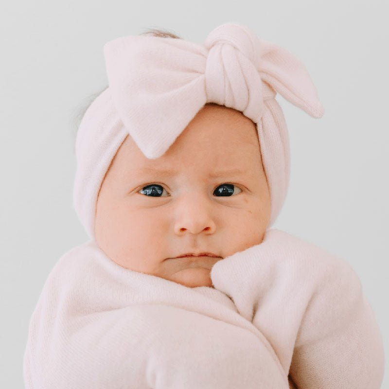 Headwrap for babies with bow, made from classic brushed fabric.