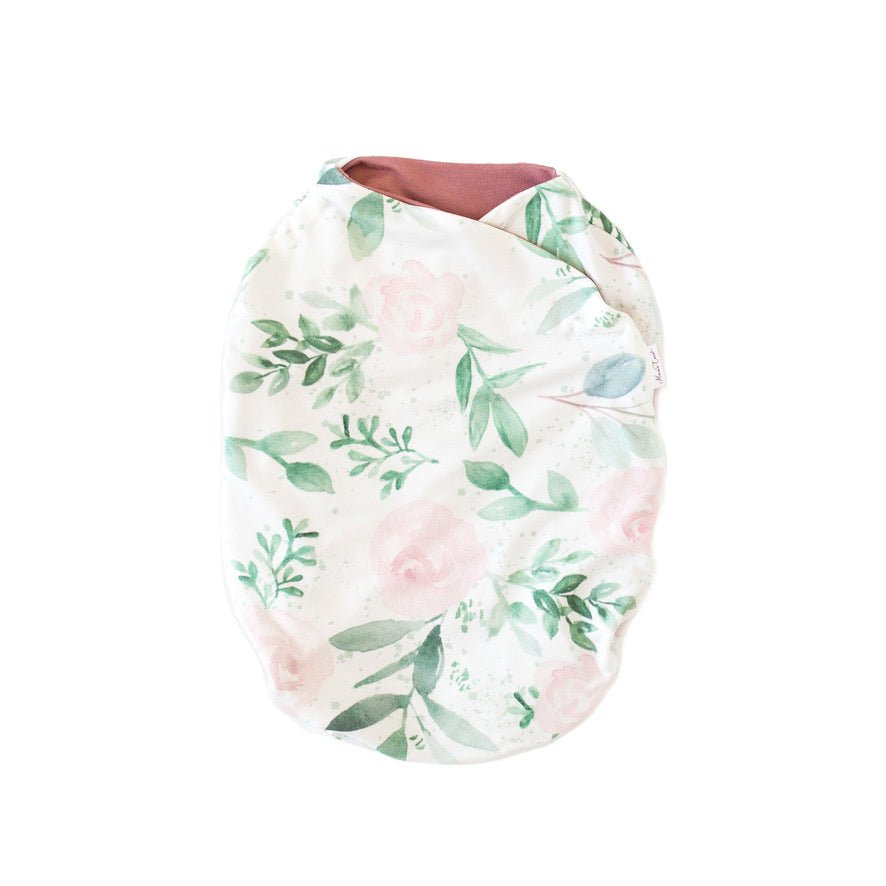 Blushing eucalyptus design baby cocoon swaddle in classic brushed fabric.