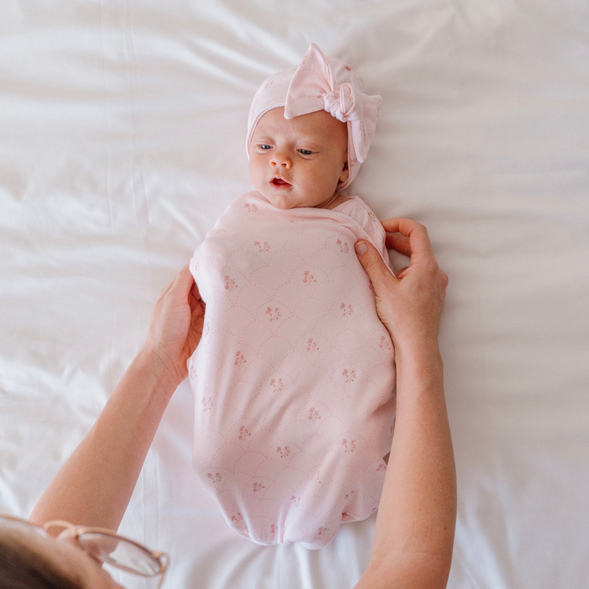 Reversible dainty dots design cocoon baby swaddle in bamboo cotton fabric.