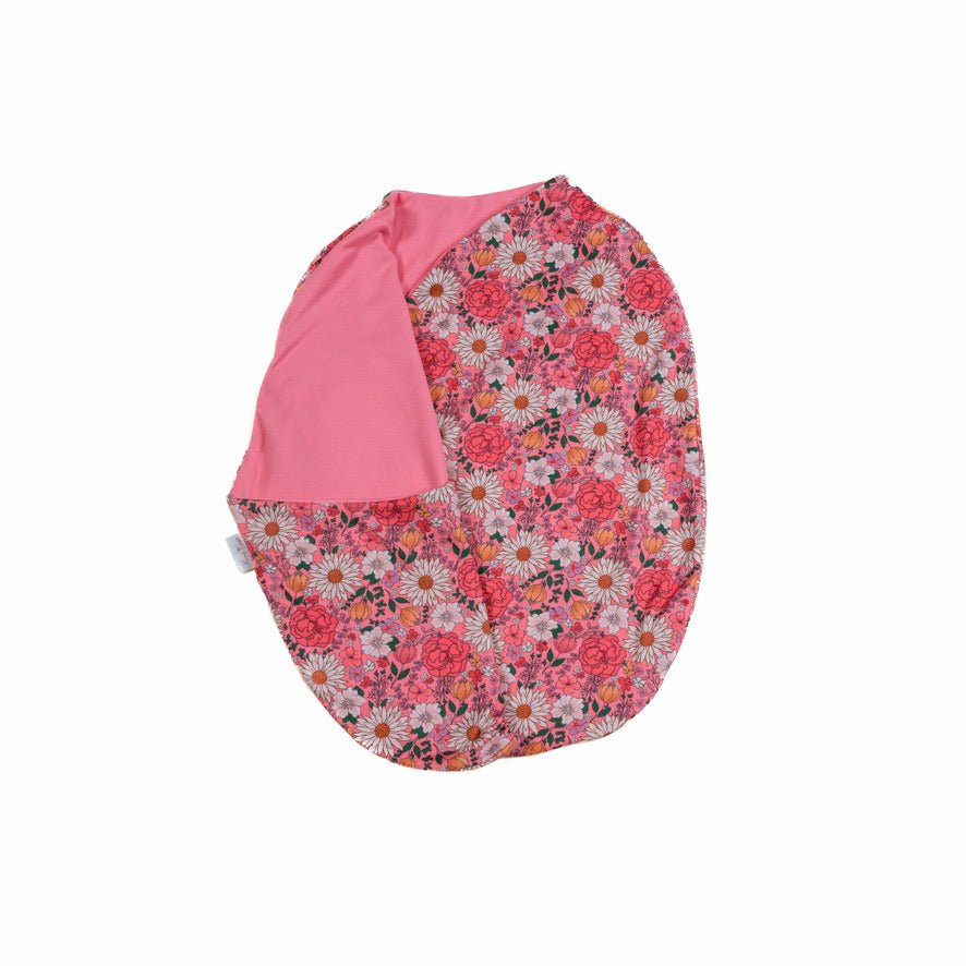 Flower power design baby cocoon swaddle in classic brushed fabric.