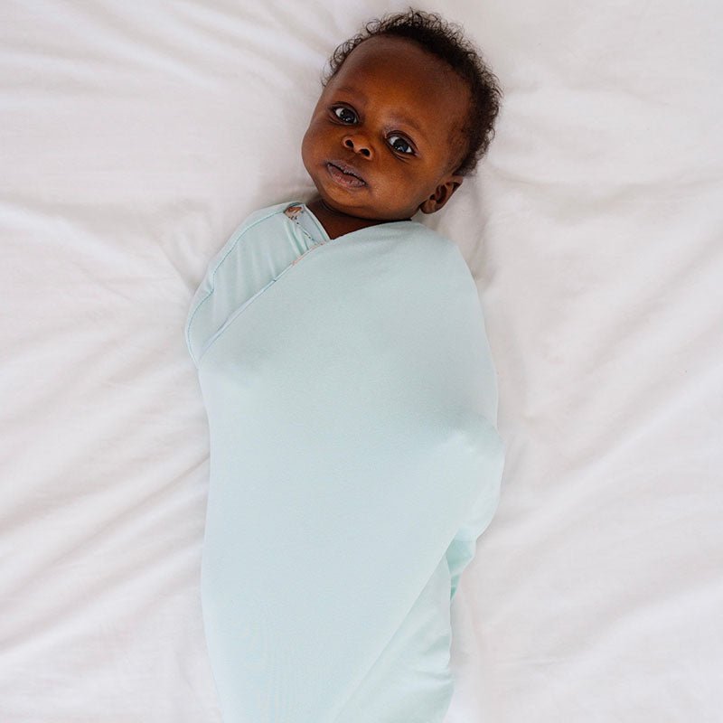Reversible breathable baby cocoon swaddle blanket in World Traveler design Silky Modal.