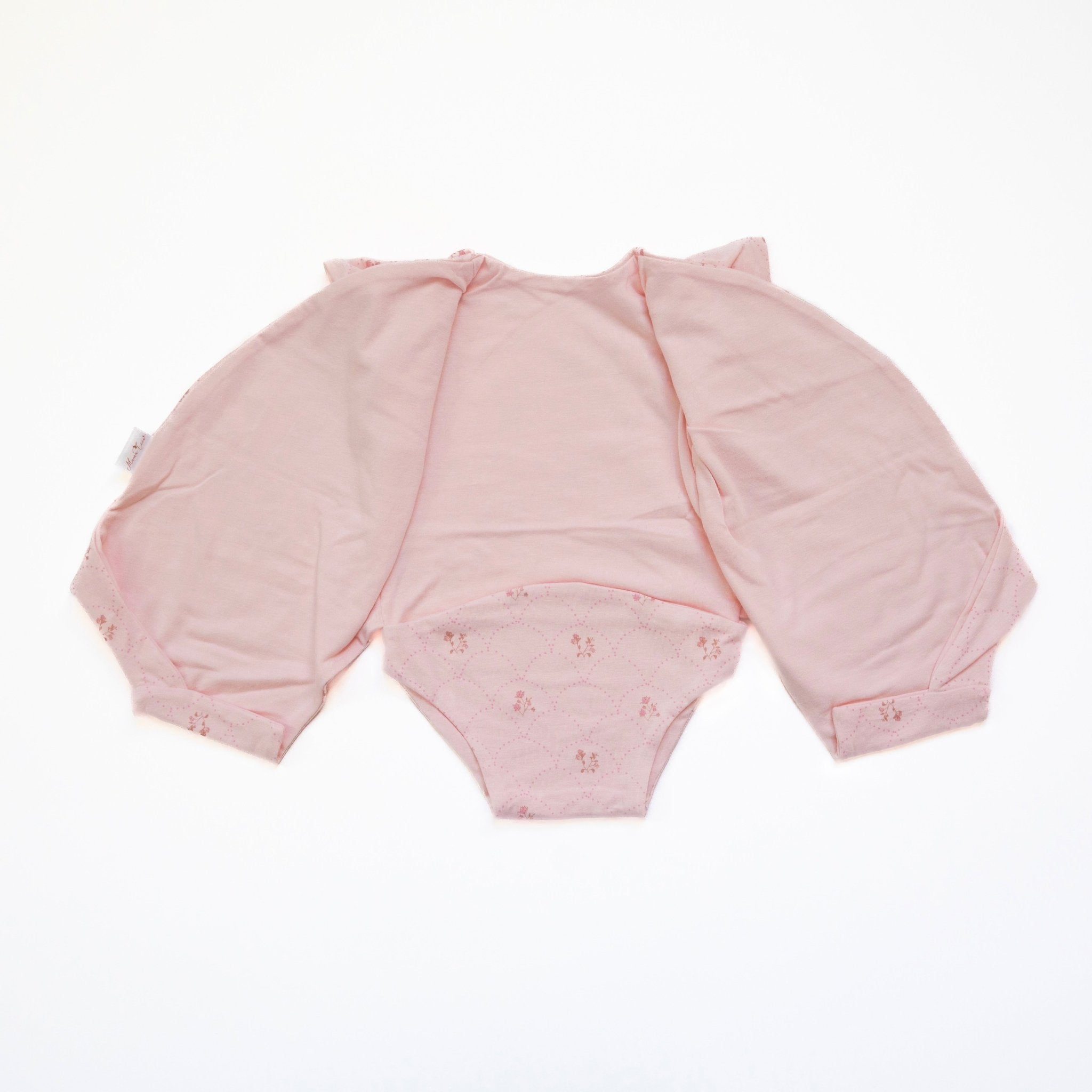 Reversible flutter sleeve winged bodysuit for babies in dainty dots design.