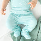 Soft and gentle baby footie pants made from bamboo cotton fabric in the Honeydew Palms design.