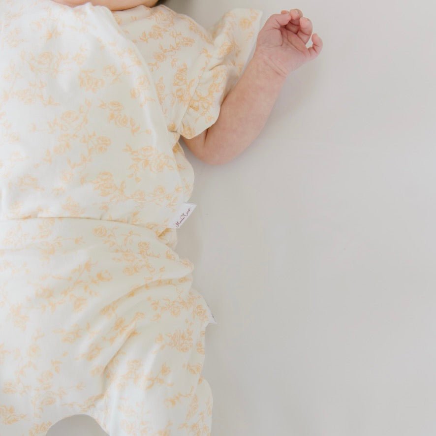 Baby footie pants in bitty blooms design.