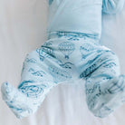 Baby footie pants in bon voyage design.