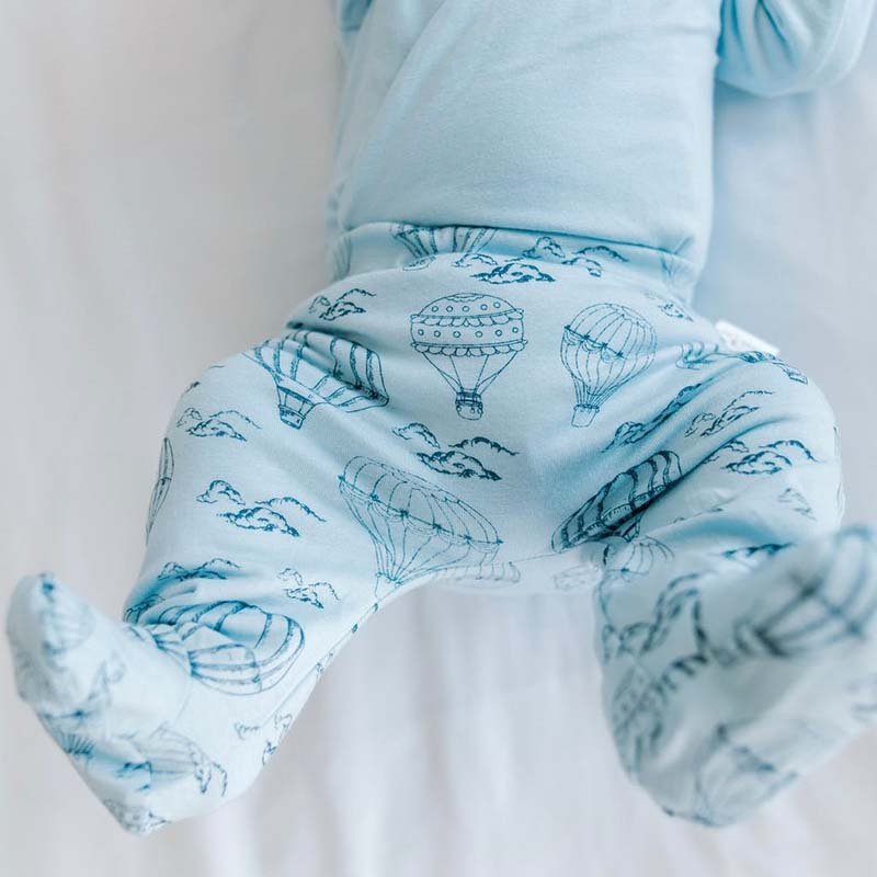 Baby footie pants in bon voyage design.