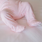 Baby footie pants in dainty dots design.