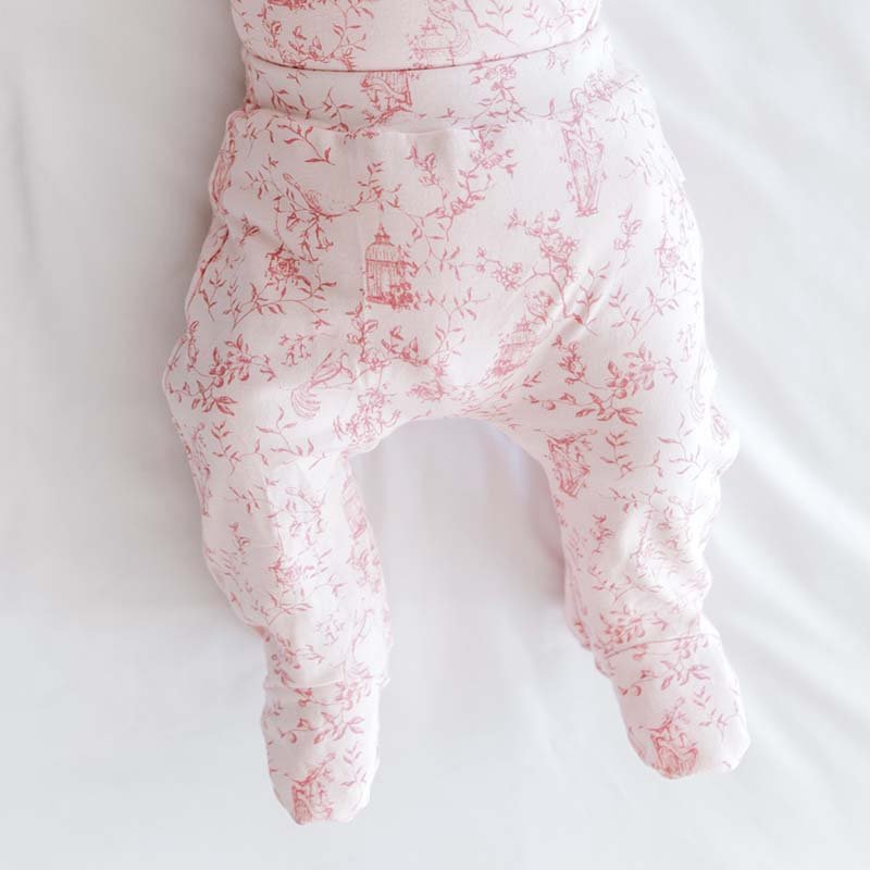 Baby footie pants in whimsical garden design.