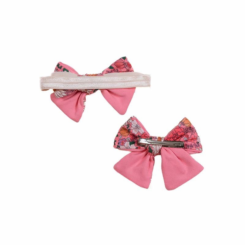 Floral baby bow headband and clip set in the Flower Power pattern.