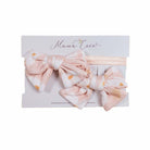 Soft baby bow headband and bow clip featuring the Sweet Lily floral print.