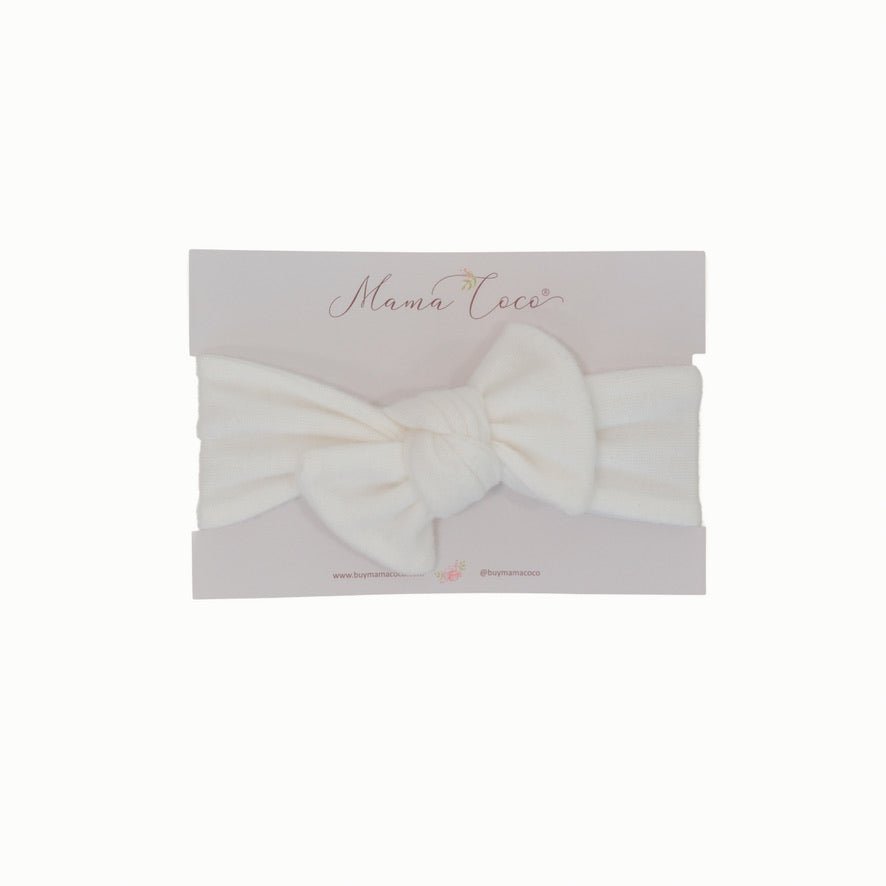 Charming baby headwrap with decorative bow in Plush Perfection styles.
