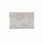Charming baby headwrap with decorative bow in Plush Perfection styles.