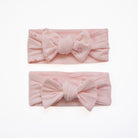 Headwrap with bow for babies made from bamboo organic cotton fabric, in dainty dots design.