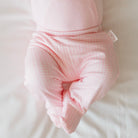 Baby Pink Gingham baby footie pants crafted from silky modal fabric for maximum comfort.