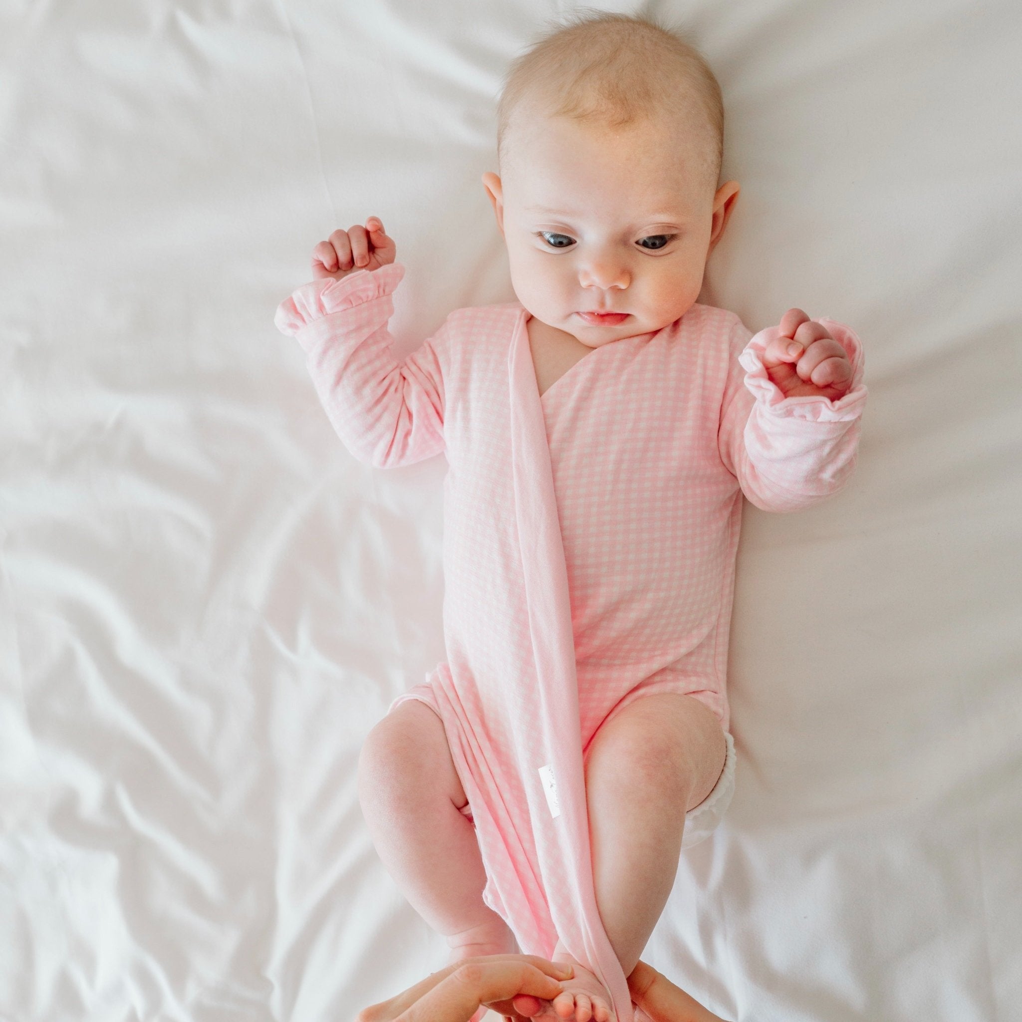 Baby Pink Gingham design ruffle cuff winged bodysuit for babies in silky modal fabric.