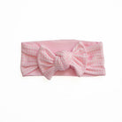 Headwrap with bow in Baby Pink Gingham design, made from silky modal fabric.