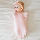 Baby Pink Gingham Cocoon swaddle baby blanket in Silky Modal fabric styles. Soft and cozy newborn wrap blanket.