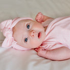 Charming headwrap with decorative bow in Baby Pink Gingham styles.