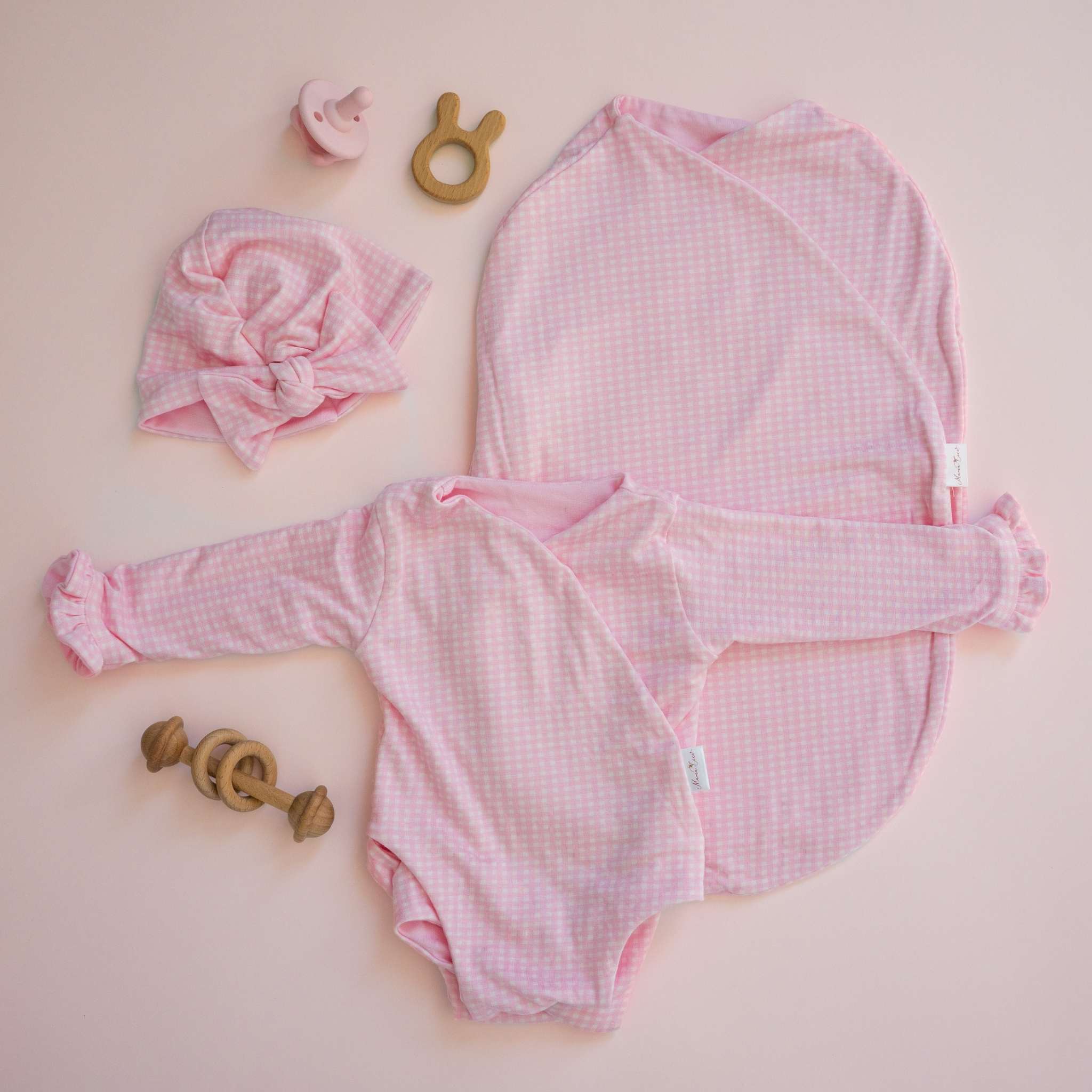 Silky modal long sleeve newborn baby bundle, featuring adorable ruffle cuffs in baby pink gingham design.