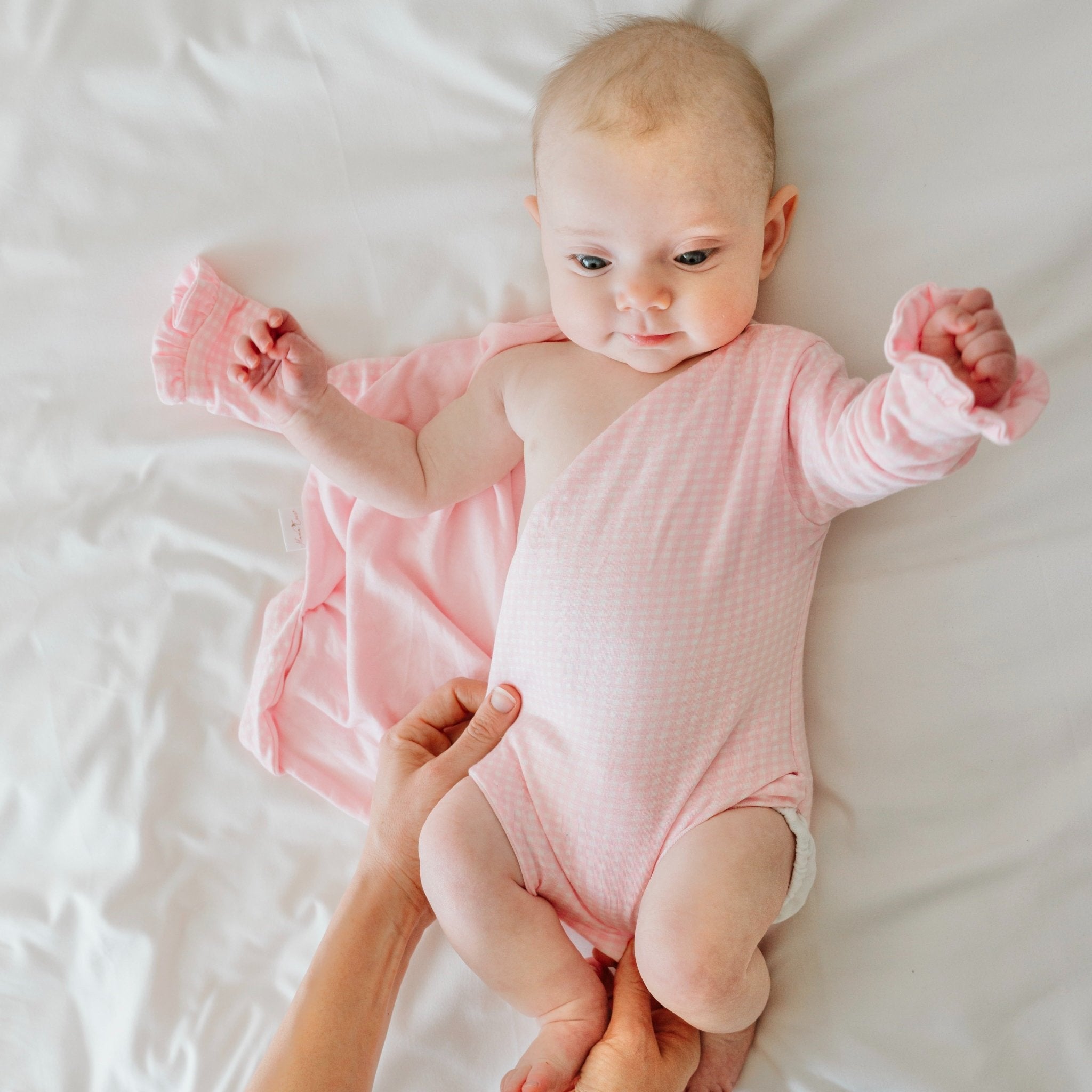 Baby Pink Gingham design ruffle cuff winged bodysuit for babies in silky modal fabric.