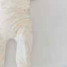 Cozy baby footie pants in silky modal fabric with an adorable Bitty Blooms pattern.