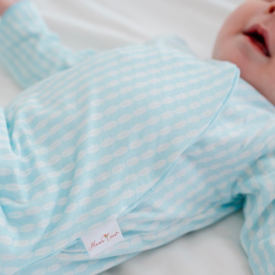 Long sleeved winged bodysuit for babies in silky modal fabric.