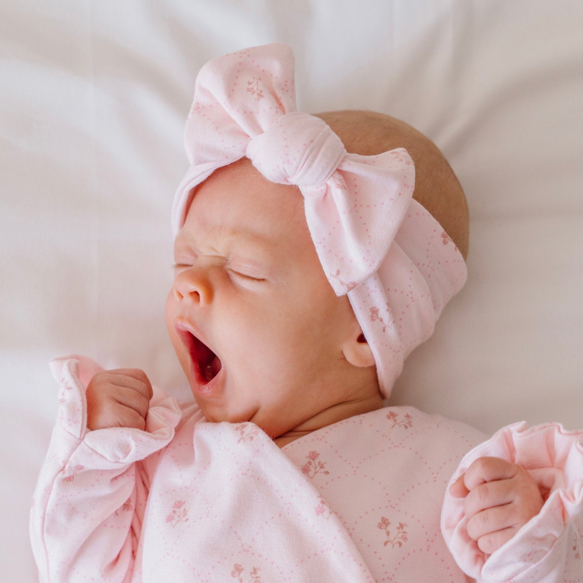 Baby bow headwrap made from bamboo and organic cotton fabric featuring a dainty dots design.