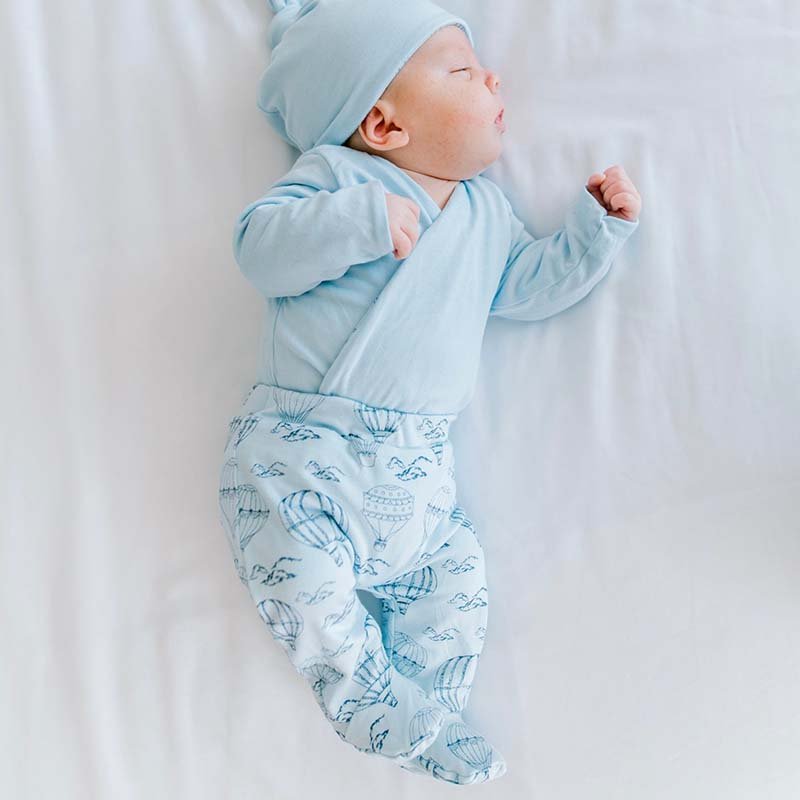 Cozy baby footie pants crafted from bamboo cotton in the bon voyage design.