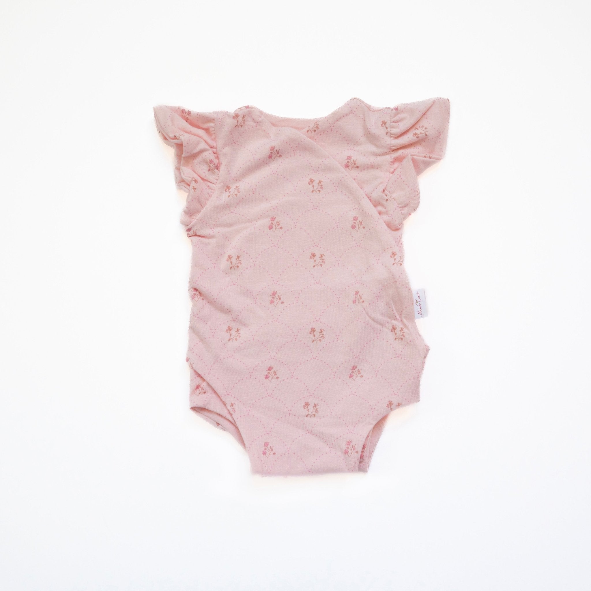 Flutter sleeve winged bodysuit for babies in dainty dots design.