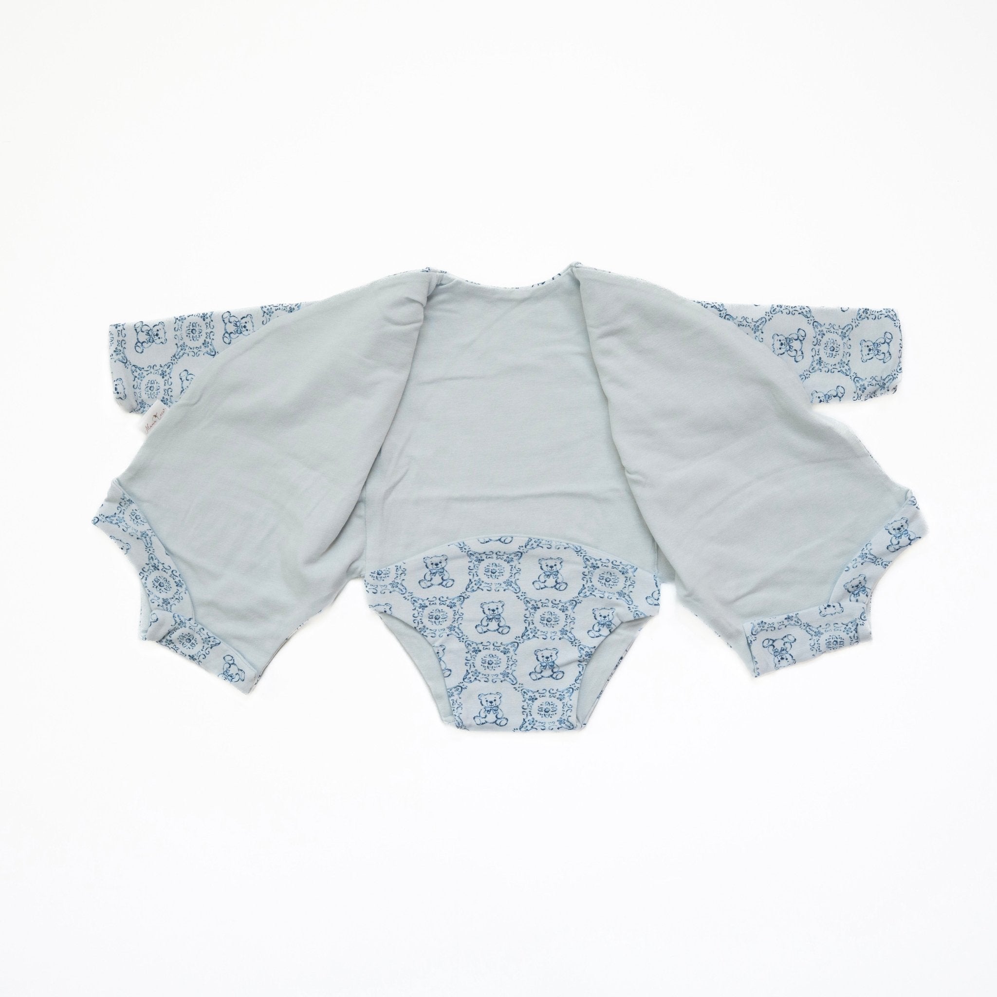 Reversible long-sleeve winged bodysuit for babies.