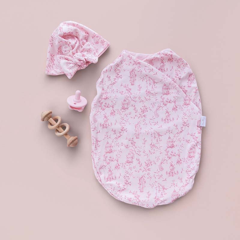 Soft and breathable baby cocoon swaddle blanket made from bamboo-organic cotton blend featuring Whimsical Garden design.