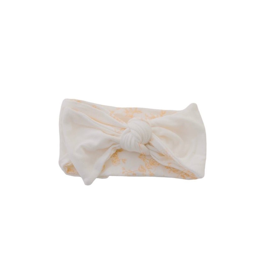 Soft and elegant headwrap with bow in Bitty Blooms design.
