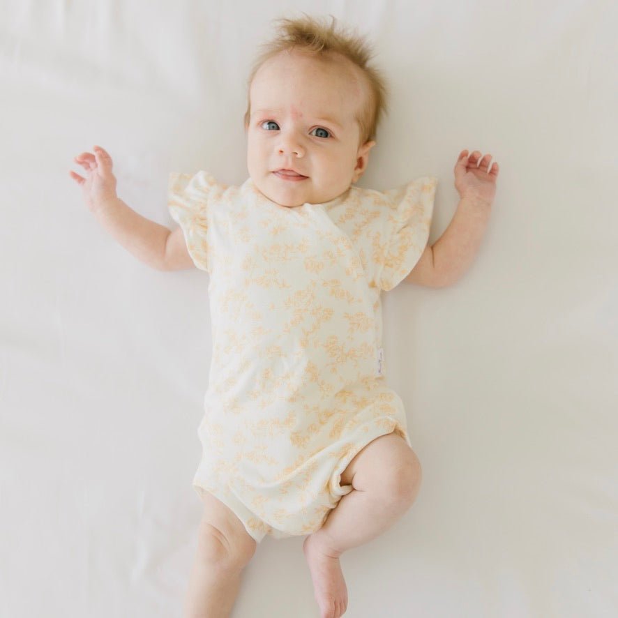 Bitty blooms design flutter sleeve baby onesie in silky modal fabric.