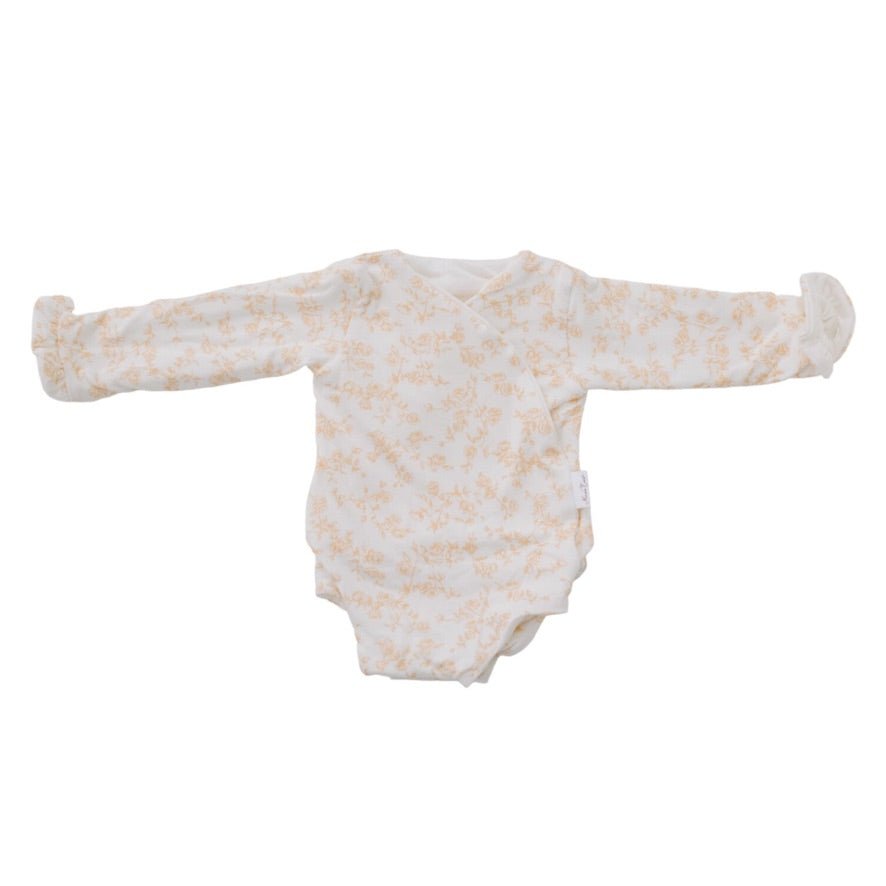Bitty Blooms design ruffle cuff long sleeve winged bodysuit in silky modal fabric.