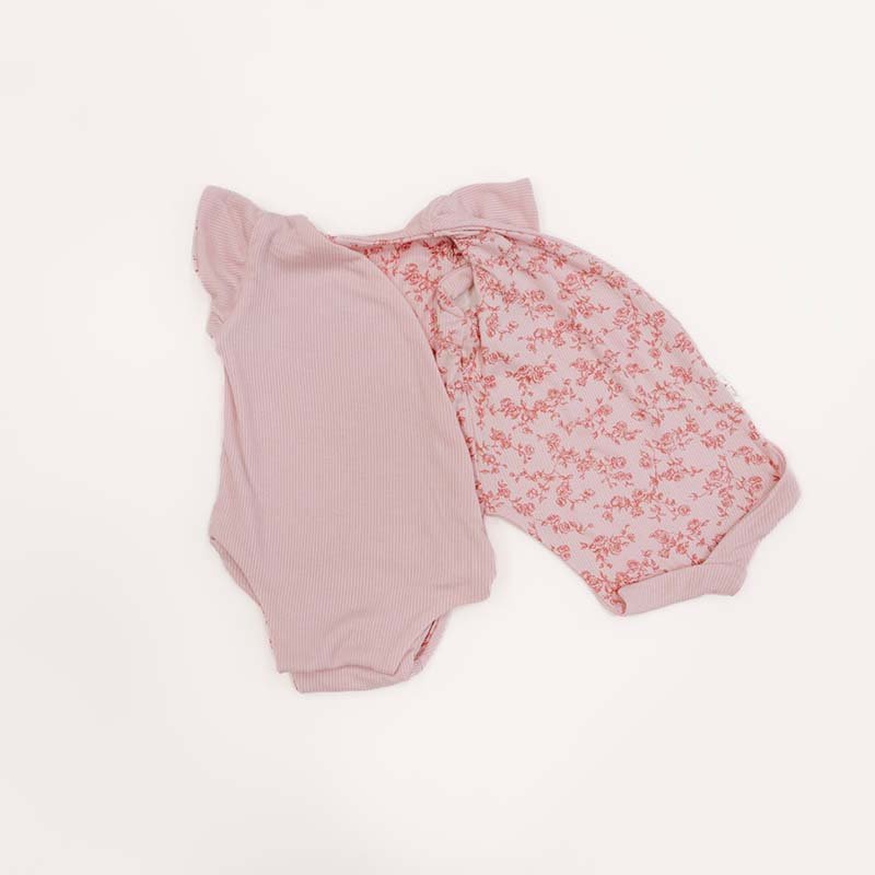 Reversible flutter sleeve baby onesie in Bitty Pink Blooms design.