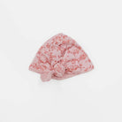 Charming ruched baby beanie with decorative bow in Bitty Pink Blooms styles.