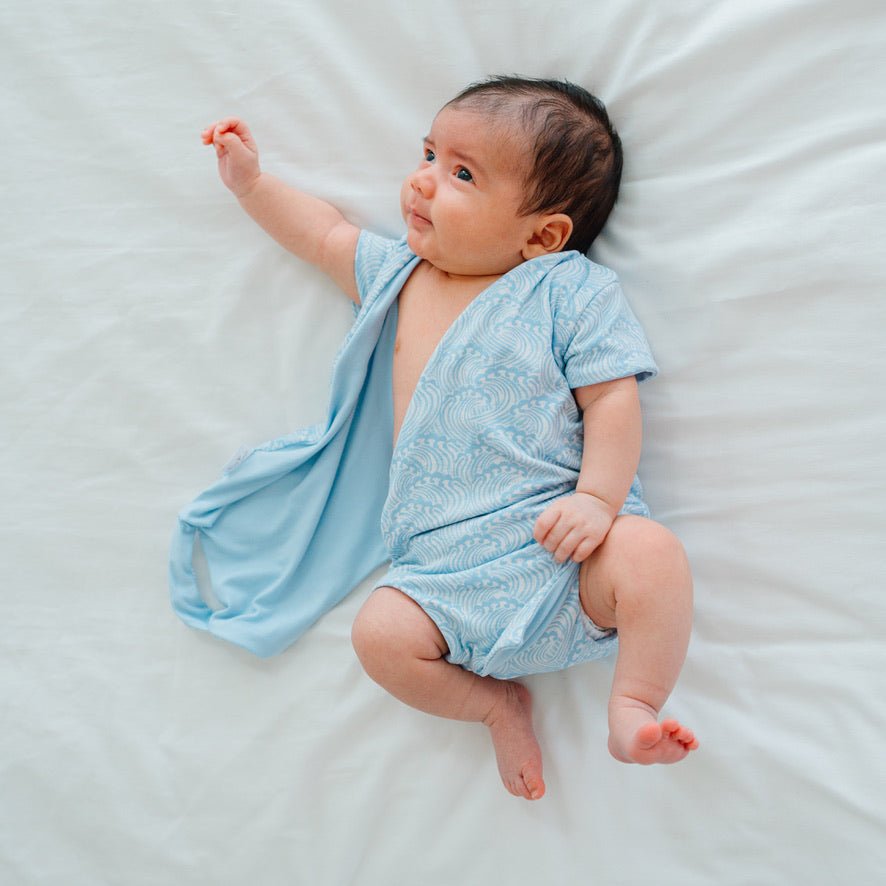 Stylish classic brushed short-sleeve winged bodysuit with the soft Blue Swells design.