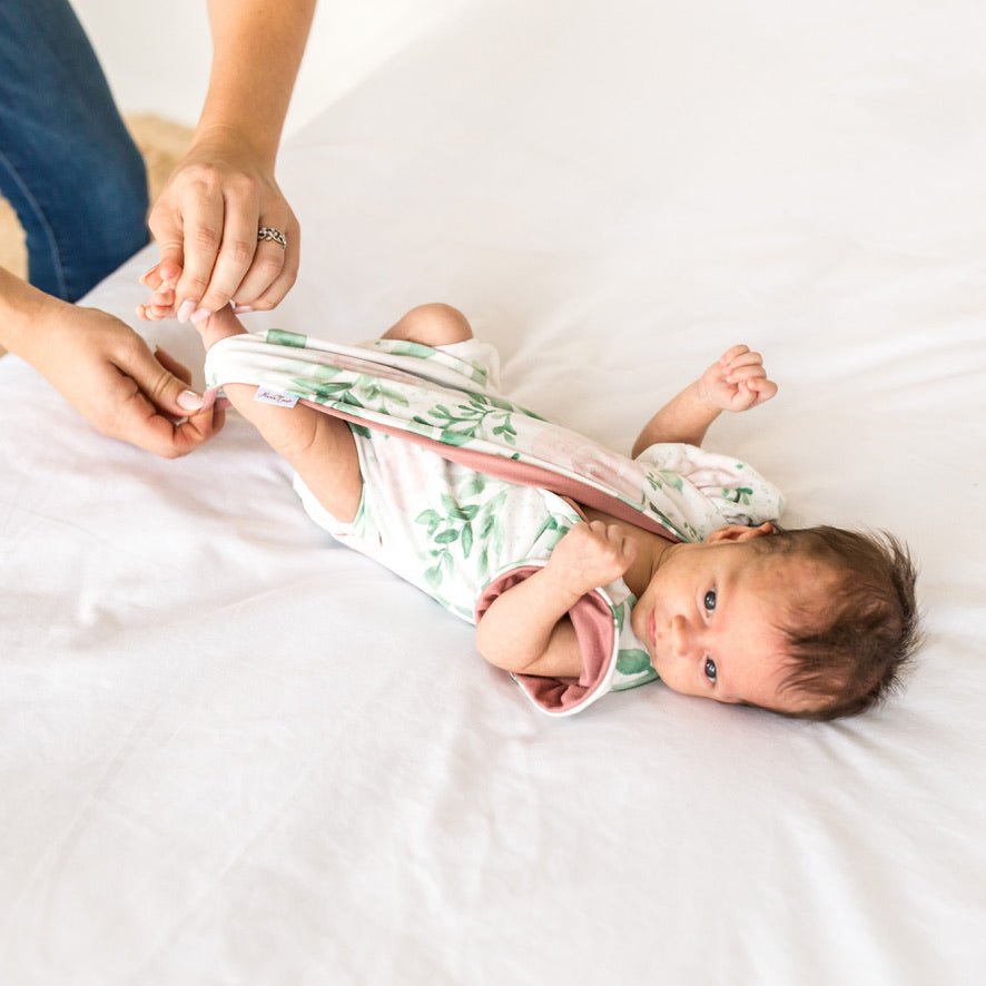 Short-sleeve bodysuit for baby in Classic Brushed fabric styles featuring the Blushing Eucalyptus print.