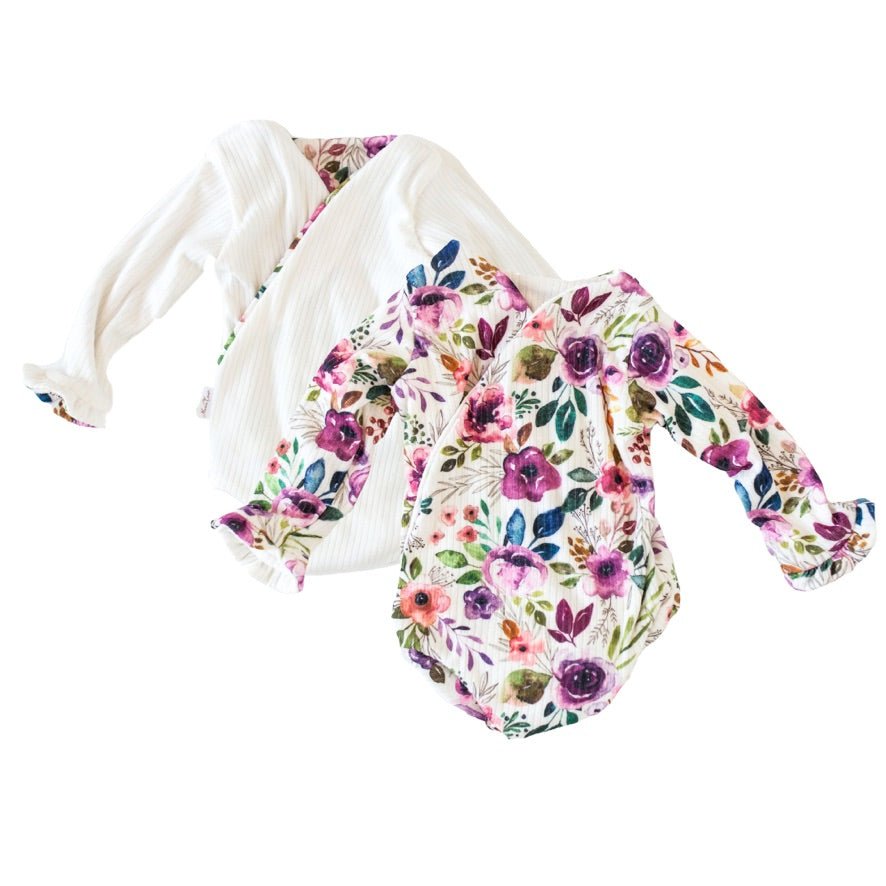 Reversible blushing eucalyptus long sleeve ruffle cuff baby onesie.
